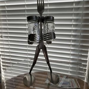 Salt and pepper holder made with forks and spoons.